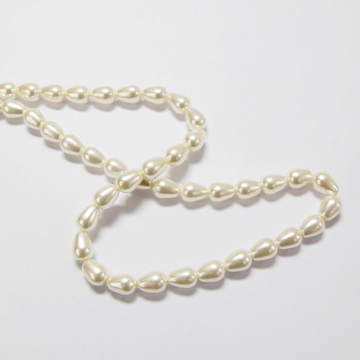Perles nacrées goutte 9 x 6mm blanc x1