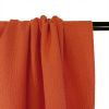 Tissu polyester texturé corail - orange x 10 cm