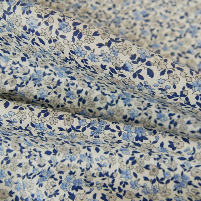 Tissu coton enduit fleurs - bleu blanc x 10 cm