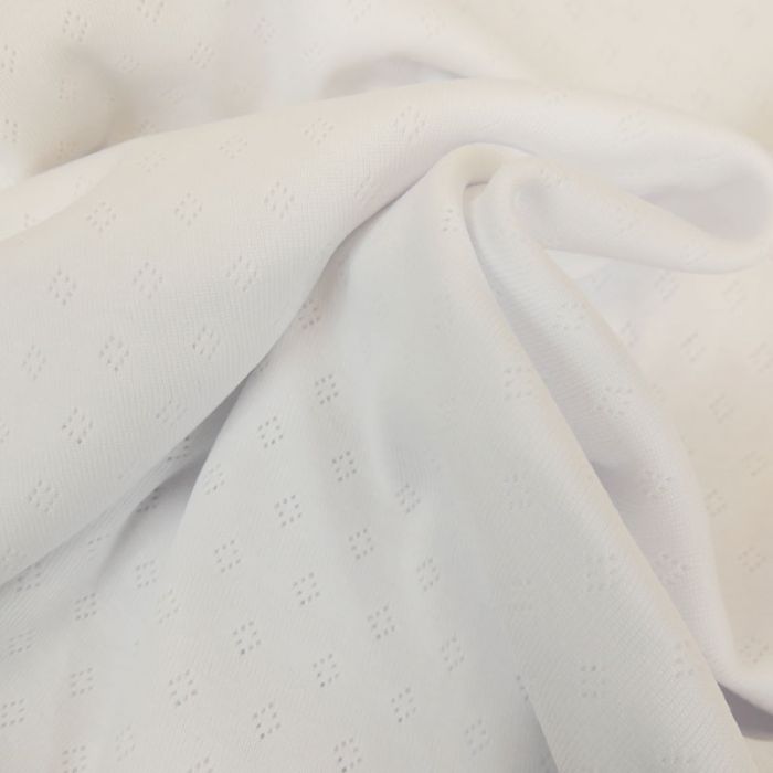 Tissu jersey ajouré - blanc x 10 cm