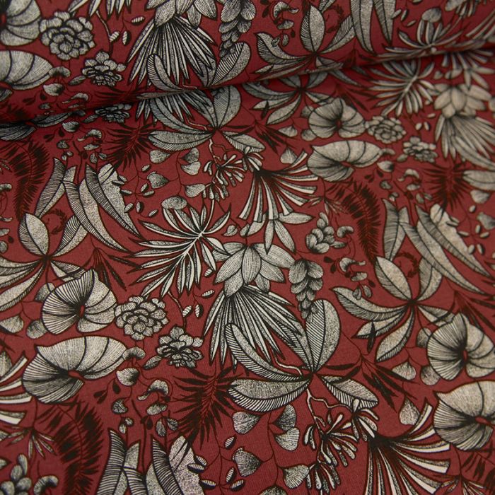 Tissu cretonne feuilles tropicales - rouge carmin x 10 cm