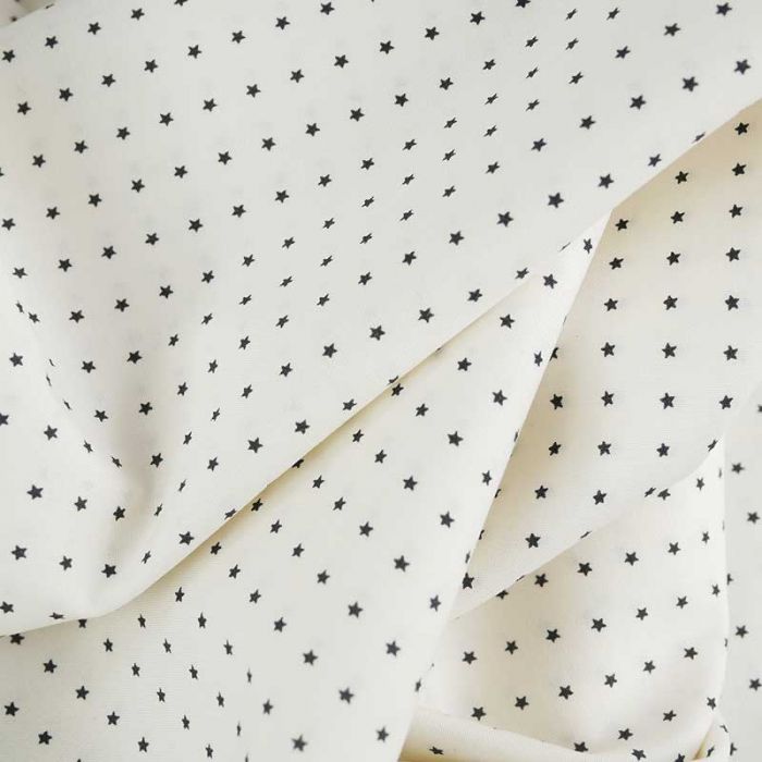 Tissu coton élasthanne écru étoiles noires - Fibre Mood x 10 cm