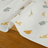 Tissu popeline coton dinosaures - blanc x 10 cm