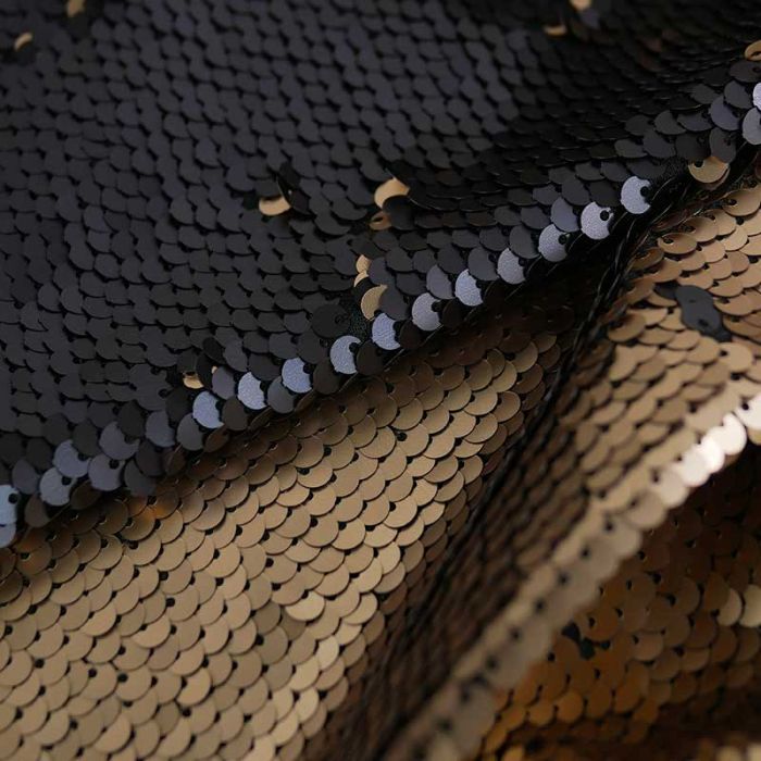 Tissu jersey sequins réversibles haute couture noir - doré x 10 cm