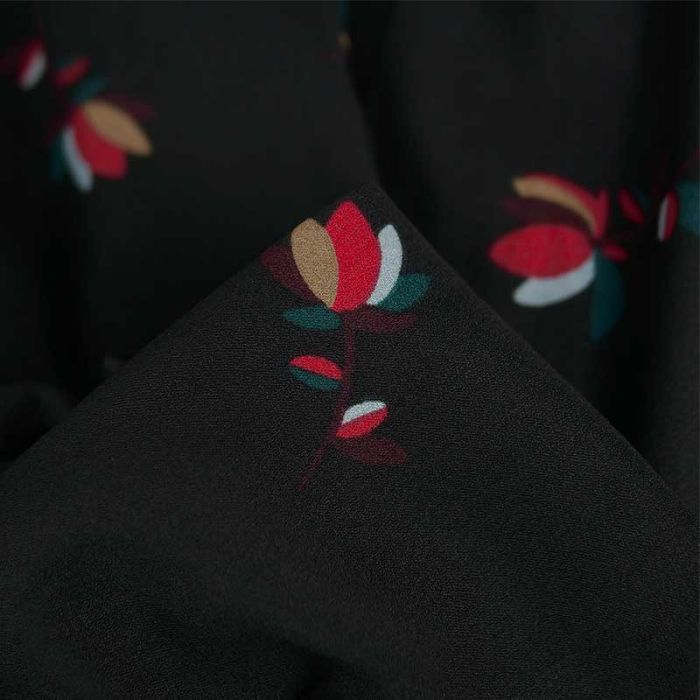 Tissu polyester fleurs Nirma - noir x 10 cm
