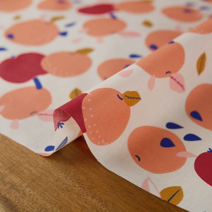 Tissu coton enduit pommes et mandarines - écru x 10 cm