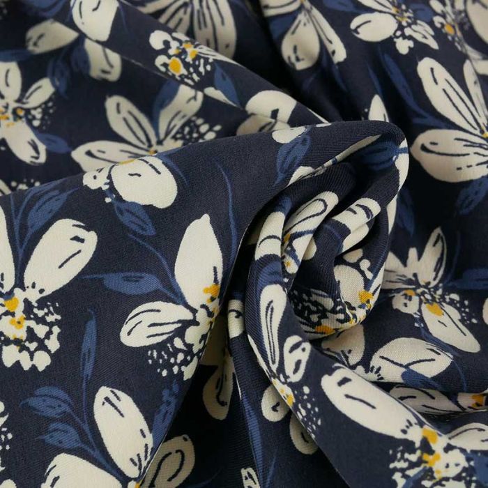 Tissu jersey fin fleurs Iberis - bleu marine x 10 cm