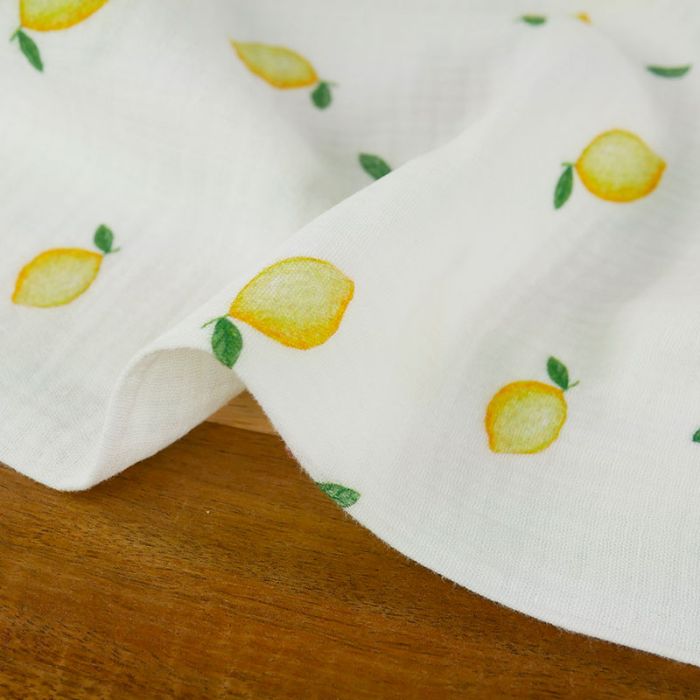 Tissu double gaze citrons jaunes - blanc x 10 cm