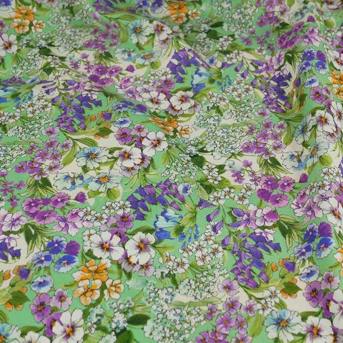 Tissu piqué de viscose fleurs violettes haute couture - vert x 10 cm