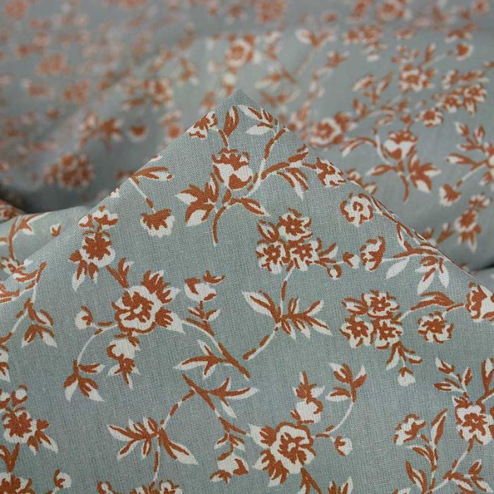 Tissu coton enduit fleurs Becca - bleu de gris x 10 cm