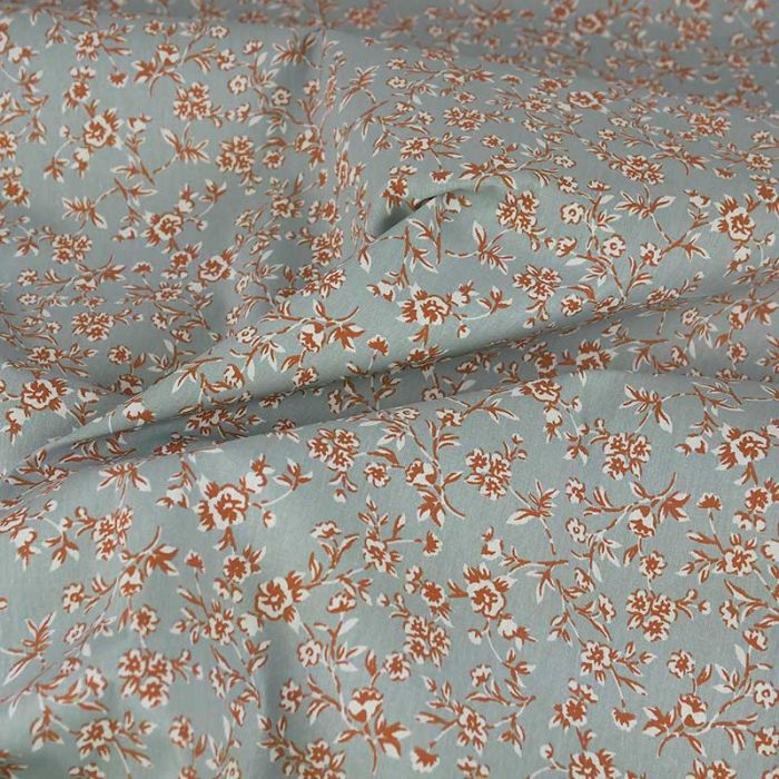 Tissu coton enduit fleurs Becca - bleu de gris x 10 cm