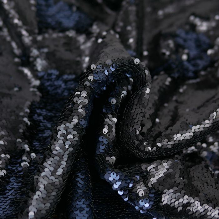 Tissu jersey sequins réversibles noir - bleu marine x 10 cm