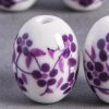 Perle en céramique Fleurie ovale violette x1