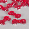 Cabochon noeud papillon arrondi à brillants 23mm rouge x1