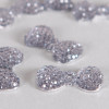 Cabochon noeud papillon arrondi à brillants 23mm gris x1
