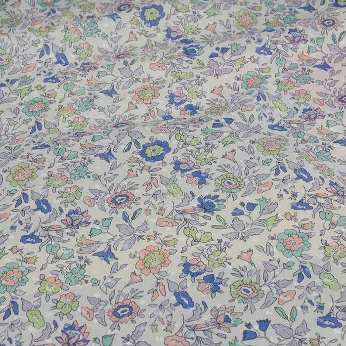Tissu coton plumetis fleurs - bleu x 10 cm