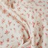 Tissu coton gaufré fleurs roses - blanc cassé x 10 cm