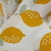 Tissu double gaze motifs citrons - blanc x 10 cm