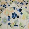 Tissu matelassé fleurs pochoirs - écru x 10 cm