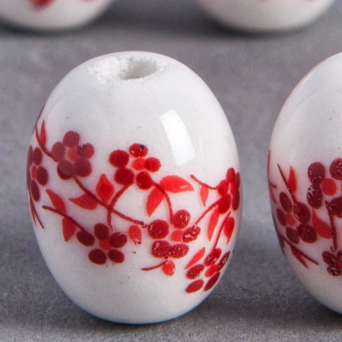 Perle en céramique Fleurie ovale rouge 14mm x1