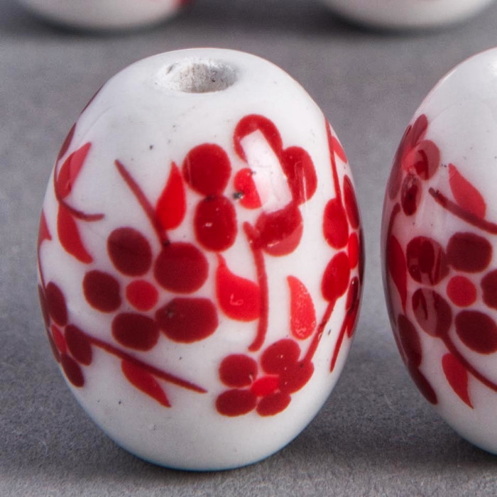 Perle en céramique Fleurie ovale rouge 18mm x1