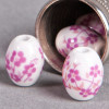 Perle en céramique Fleurie ovale rose 10mm x1