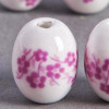 Perle en céramique Fleurie ovale rose 14mm x1