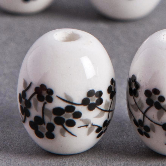Perle en céramique Fleurie ovale noire 14mm x1