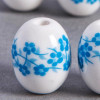 Perle en céramique Fleurie ovale bleu turquoise 14mm x1