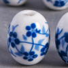 Perle en céramique Fleurie ovale bleu roi 18mm x1