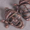 Breloque tête de mort pirate 27mm cuivre x1