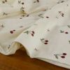 Tissu jersey éponge coton cerises - écru x 10 cm