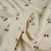 Tissu jersey éponge coton cerises - écru x 10 cm