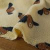 Tissu fausse fourrure sherpa chiens - écru x 10 cm