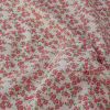 Tissu popeline coton jardin de fleurs roses - blanc cassé x 10 cm