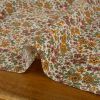 Tissu popeline coton fleurs orange - blanc cassé x 10 cm
