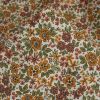 Tissu popeline coton fleurs orange - blanc cassé x 10 cm
