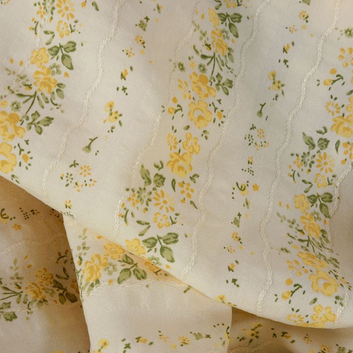 Tissu voile coton broderie fleurs jaunes - écru x 10 cm