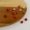 Bouton à pied métal doré - rouge x1