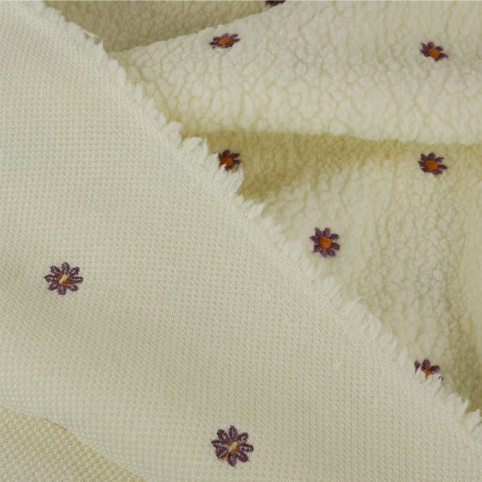 Tissu fausse fourrure Teddy fleurs brodées - écru x 10 cm