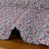 Tissu double gaze matelassée réversible fleurs - indigo x 10 cm