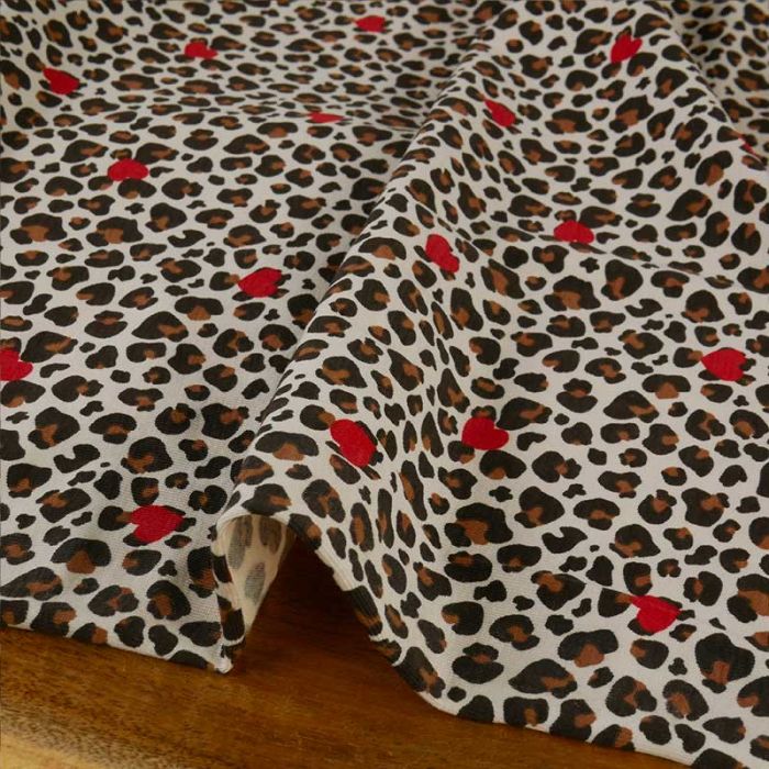 Tissu jersey fin léopard coeurs - écru x 10 cm