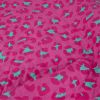 Tissu matelassé réversible léopard et fleurs - rose fuchsia x 10 cm