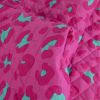 Tissu matelassé réversible léopard et fleurs - rose fuchsia x 10 cm