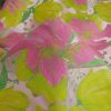 Tissu jacquard fleurs rose - jaune fluo x 10 cm