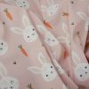 Tissu imperméable souple lapins - rose clair x 10 cm