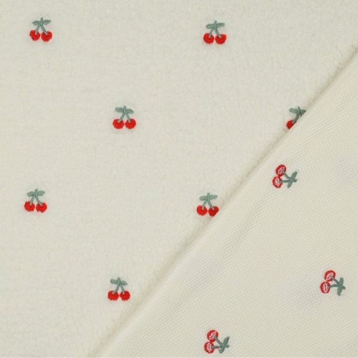 Tissu fausse fourrure sherpa broderie cerises - écru x 10 cm