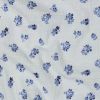 Tissu double gaze plumetis fleurs bleues - blanc x 10 cm