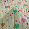 Tissu double gaze matelassée réversible coeurs - multicolore x 10 cm