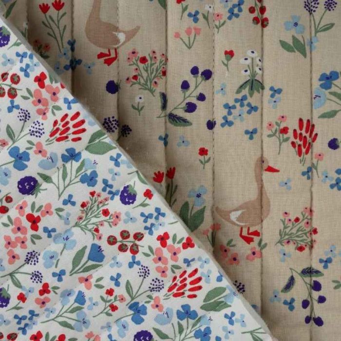 Tissu matelassé réversible animaux et fleurs - beige x 10 cm